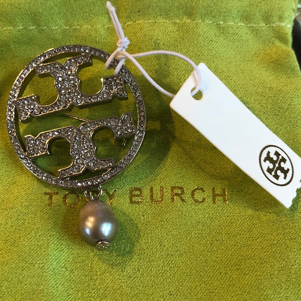 Authentic New with tag Tory Burch brooch with pouch